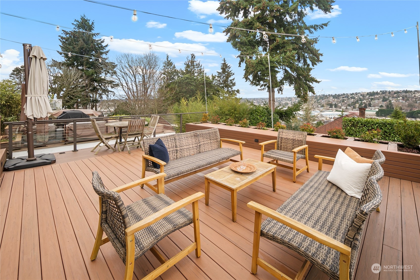1020 West Ruffner Street Seattle, WA 98119 - Photo 35 of 39 a view of a roof deck with couches and wooden floor