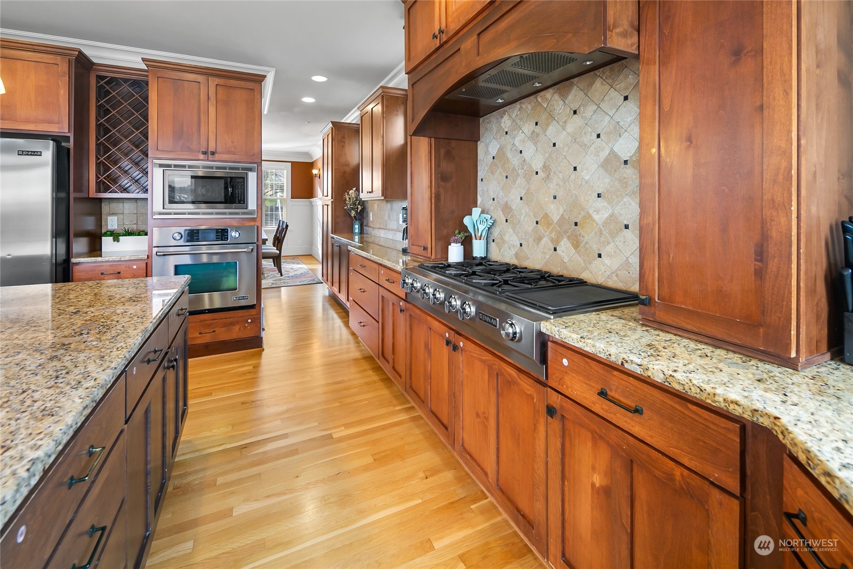 1020 West Ruffner Street Seattle, WA 98119 - Photo 5 of 39 a kitchen with stainless steel appliances granite countertop a stove a sink and a refrigerator