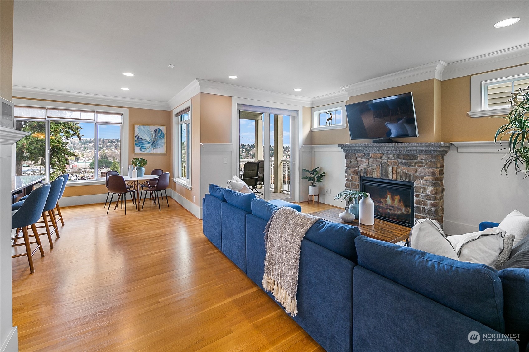 1020 West Ruffner Street Seattle, WA 98119 - Photo 9 of 39 a living room with furniture fireplace and a flat screen tv