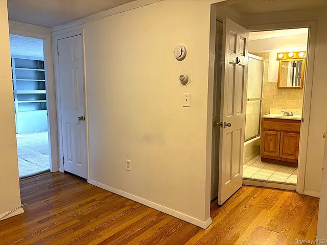 a view of a bathroom with a glass door shower and a sink