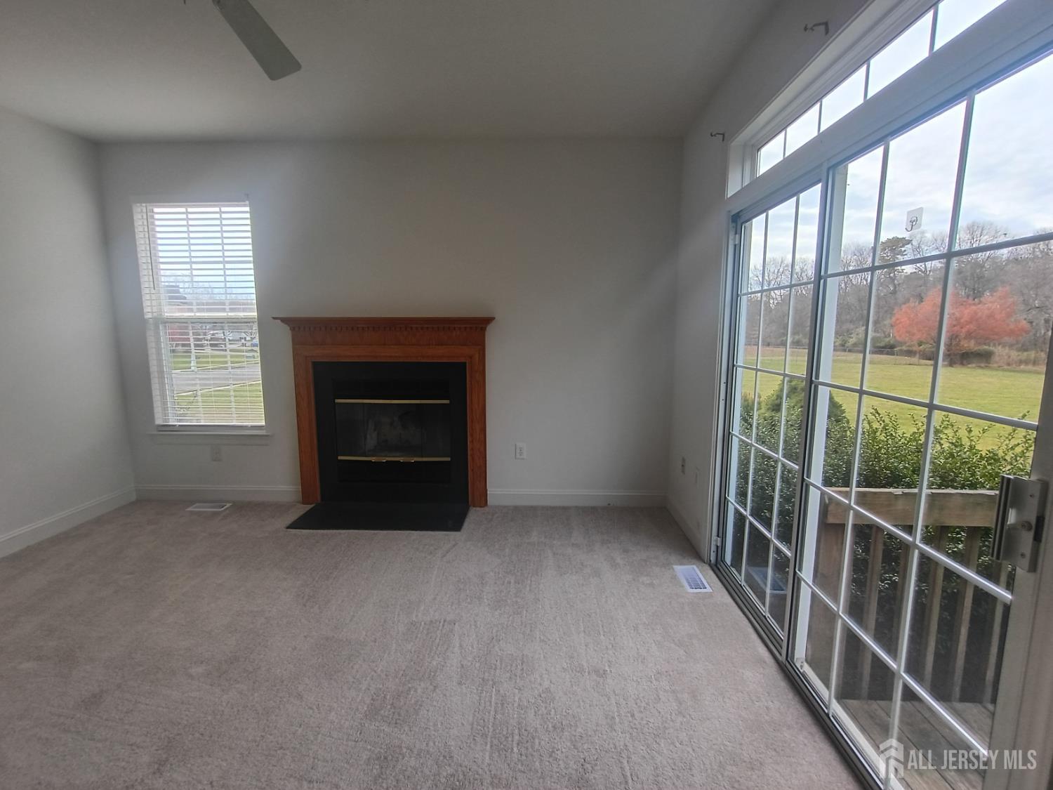 43 Brent Drive Howell, NJ 07731 - Photo 15 of 15 an empty room with windows and fireplace