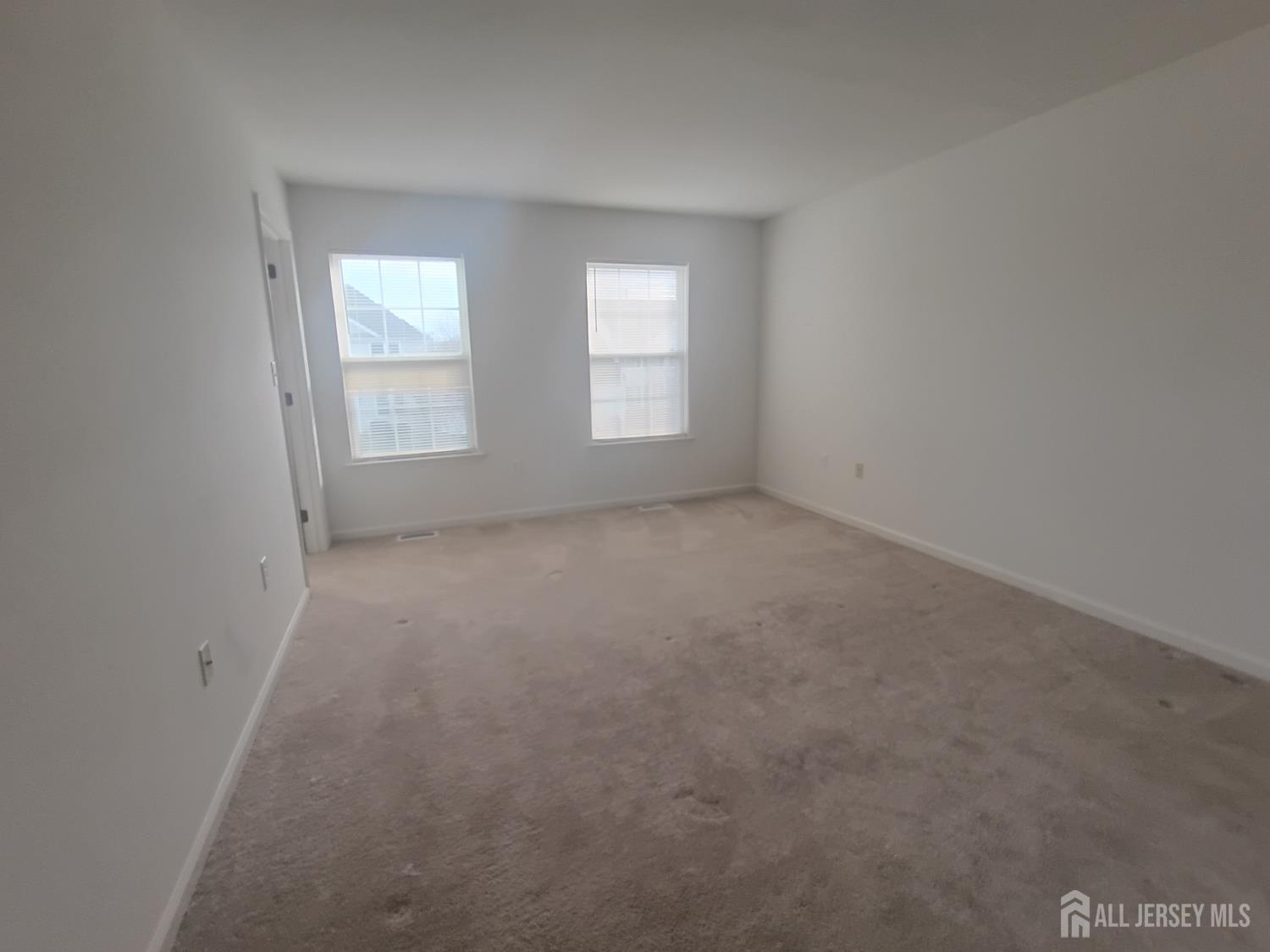43 Brent Drive Howell, NJ 07731 - Photo 7 of 15 an empty room with windows