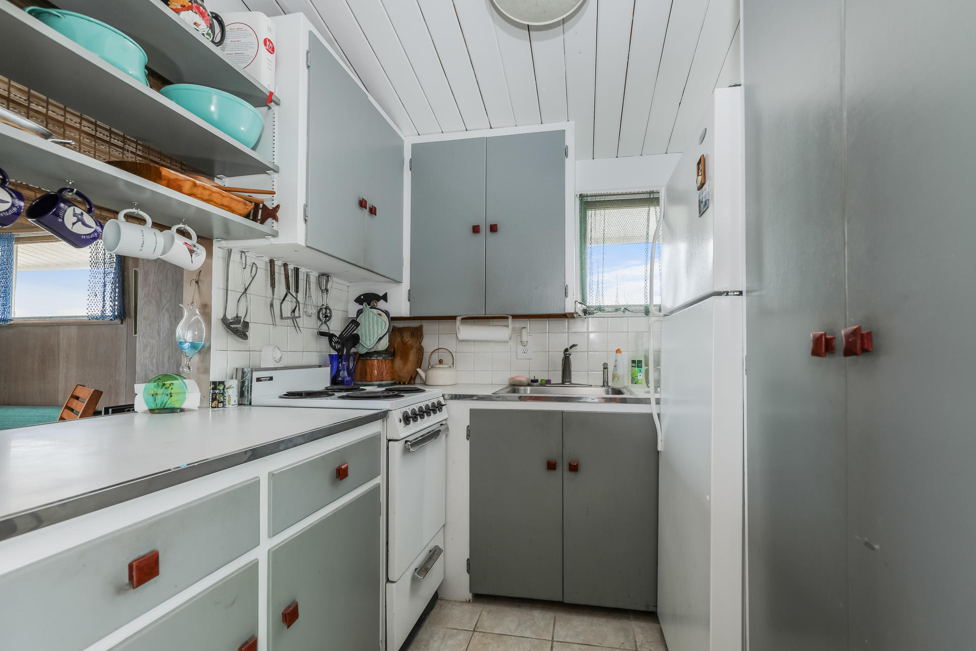800 Ocean View Drive Wellfleet, MA 02667 - Photo 23 of 38 a kitchen with stainless steel appliances granite countertop a sink and cabinets
