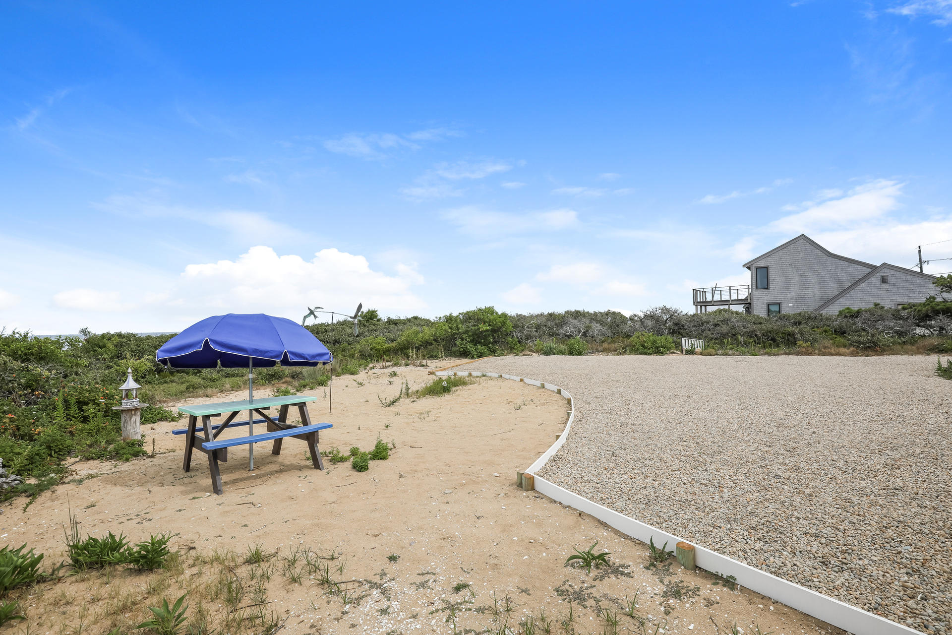 800 Ocean View Drive Wellfleet, MA 02667 - Photo 36 of 38 a view of a lake with a table and chairs