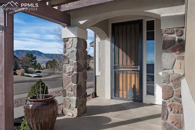 533 Talus Road Monument, CO 80132 - Photo 5 of 46 Property entrance with a mountain view and a patio
