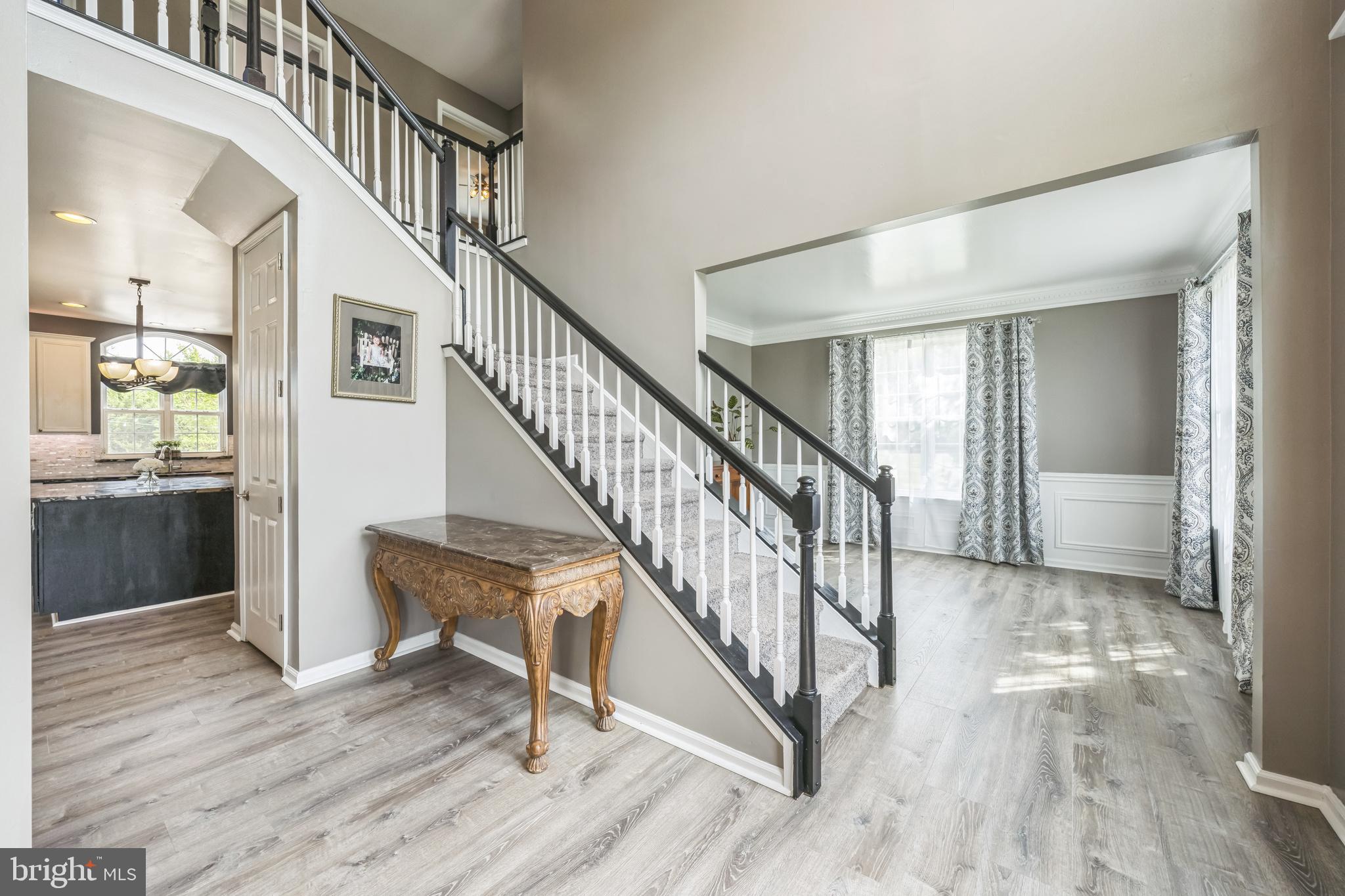 104 Abigail Lane Mickleton, NJ 08056 - Photo 13 of 75 a view of entryway and hall with wooden floor