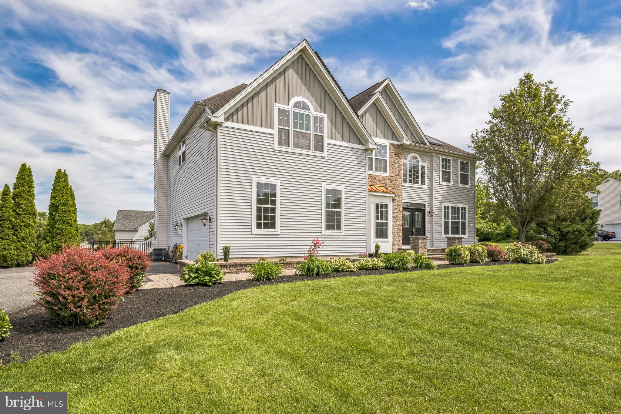 104 Abigail Lane Mickleton, NJ 08056 - Photo 2 of 75 a front view of a house with a yard