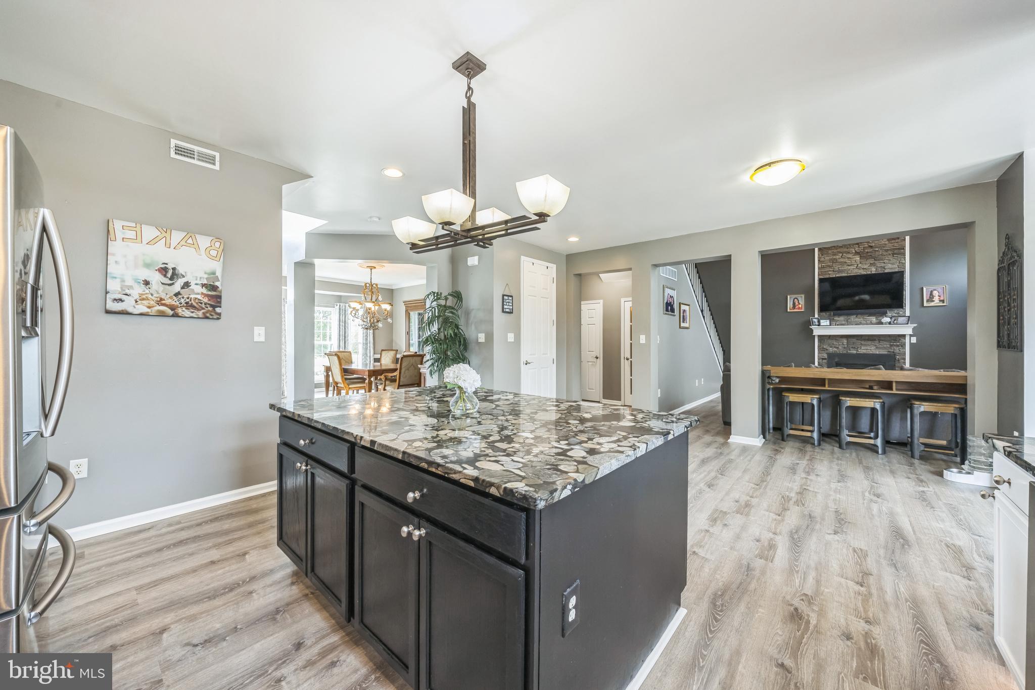 104 Abigail Lane Mickleton, NJ 08056 - Photo 24 of 75 a kitchen with stainless steel appliances granite countertop sink stove and refrigerator