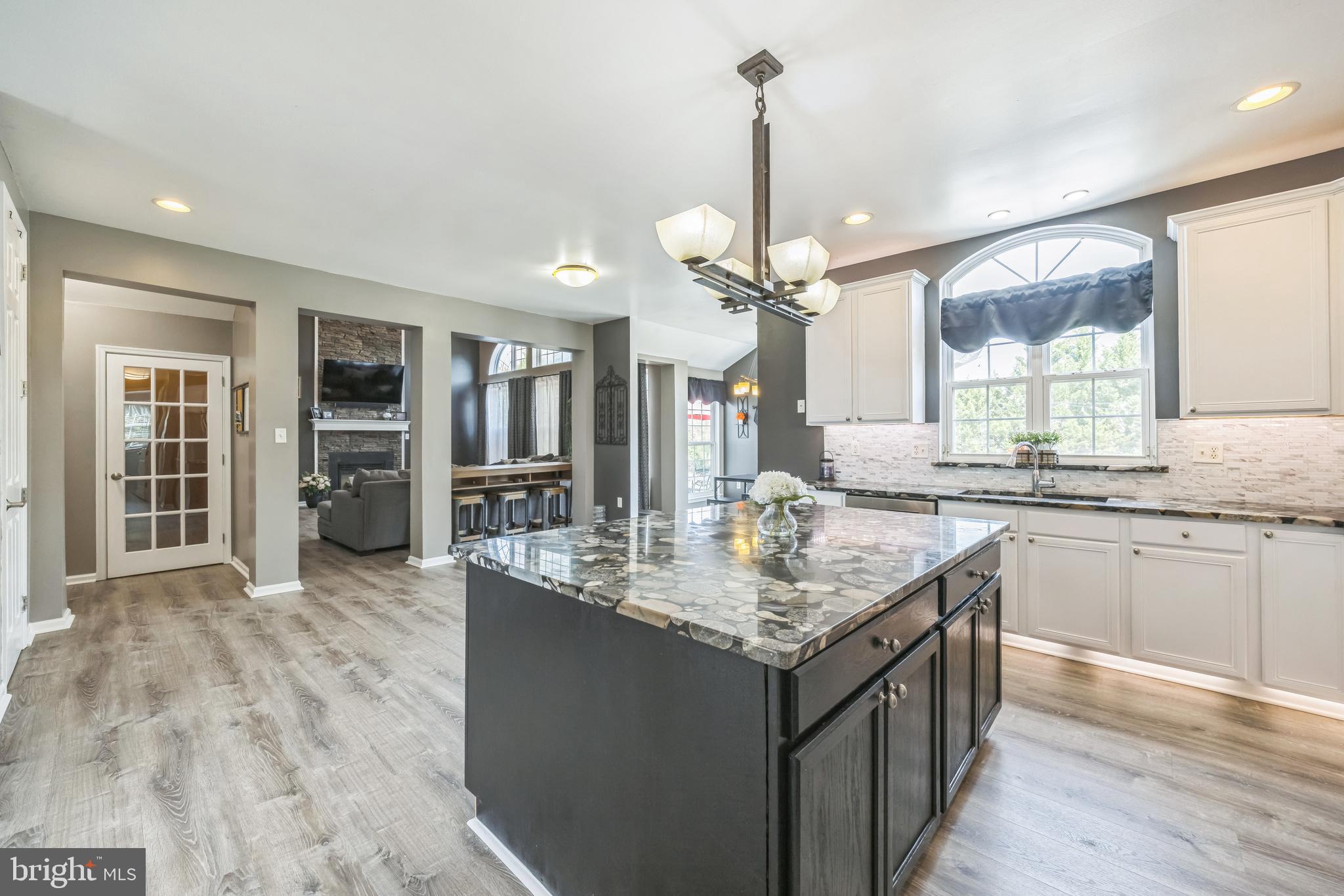 104 Abigail Lane Mickleton, NJ 08056 - Photo 26 of 75 a kitchen with kitchen island granite countertop a sink appliances and cabinets
