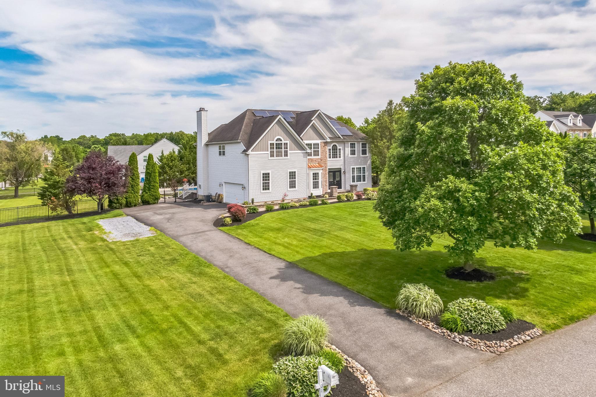 104 Abigail Lane Mickleton, NJ 08056 - Photo 3 of 75 a front view of a house with a yard and potted plants