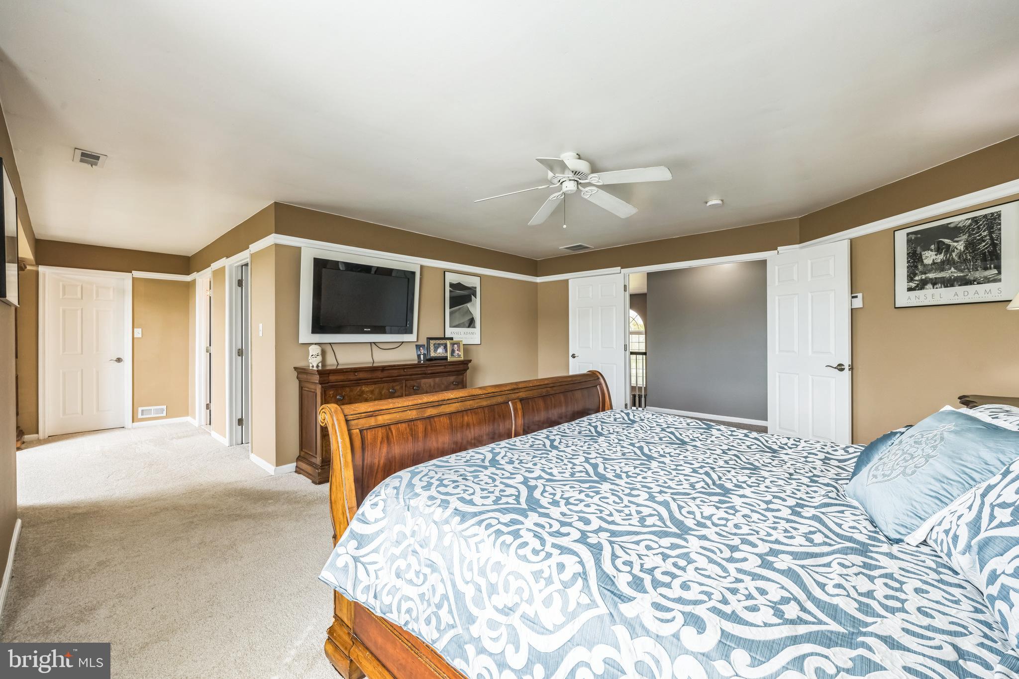 104 Abigail Lane Mickleton, NJ 08056 - Photo 34 of 75 a bedroom with a bed and a flat screen tv