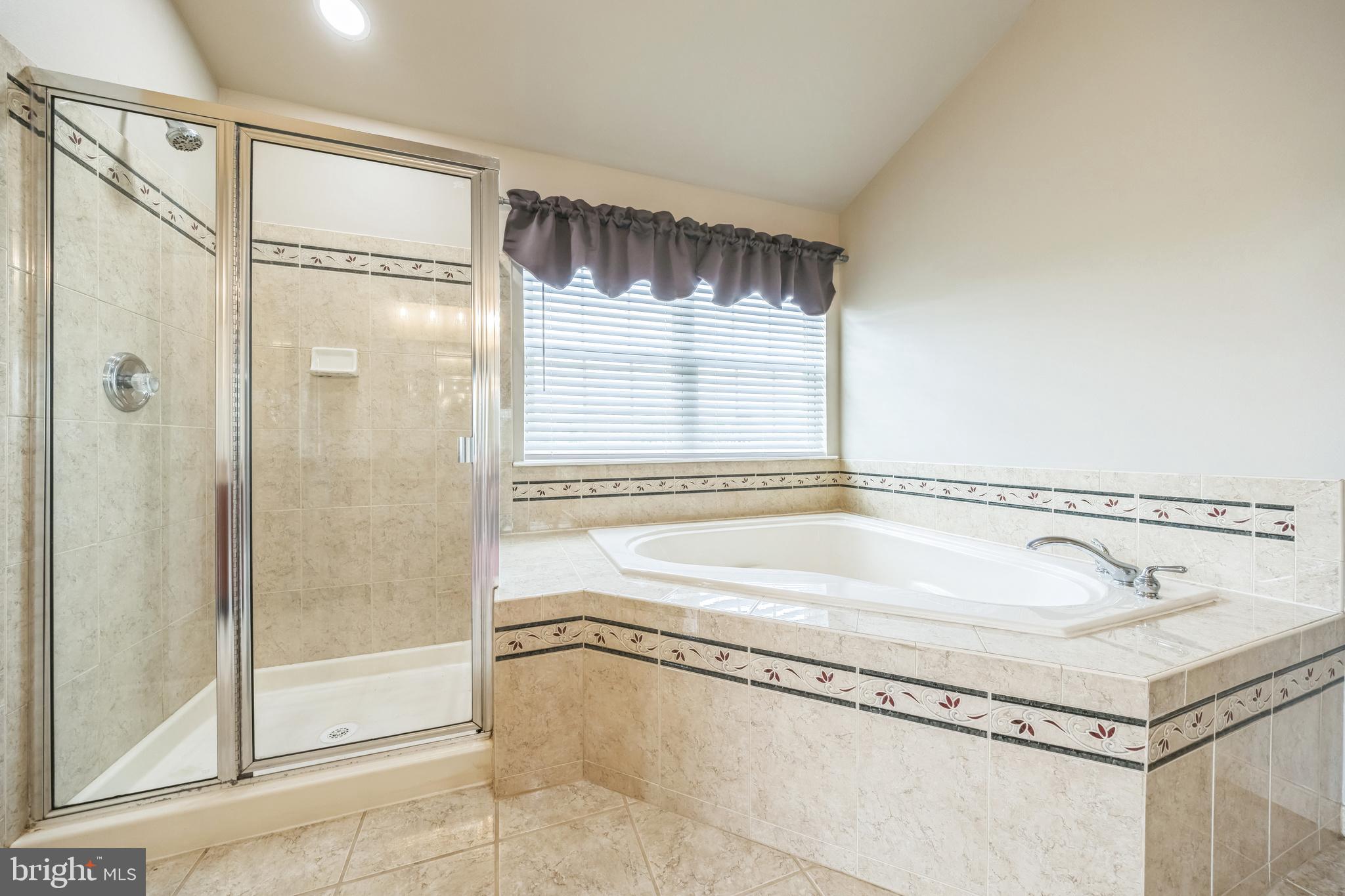 104 Abigail Lane Mickleton, NJ 08056 - Photo 37 of 75 a bathroom with a tub and a shower