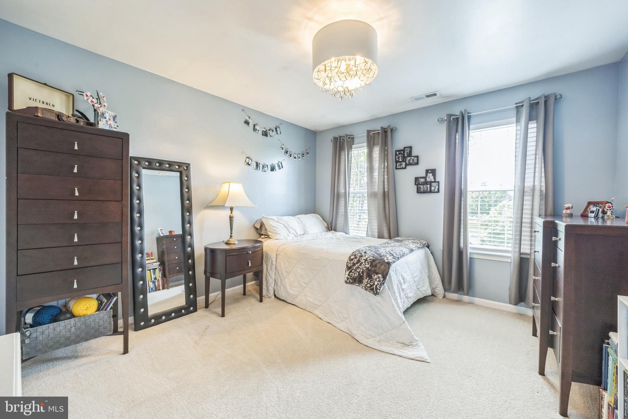 104 Abigail Lane Mickleton, NJ 08056 - Photo 42 of 75 a spacious bedroom with a bed and a chandelier