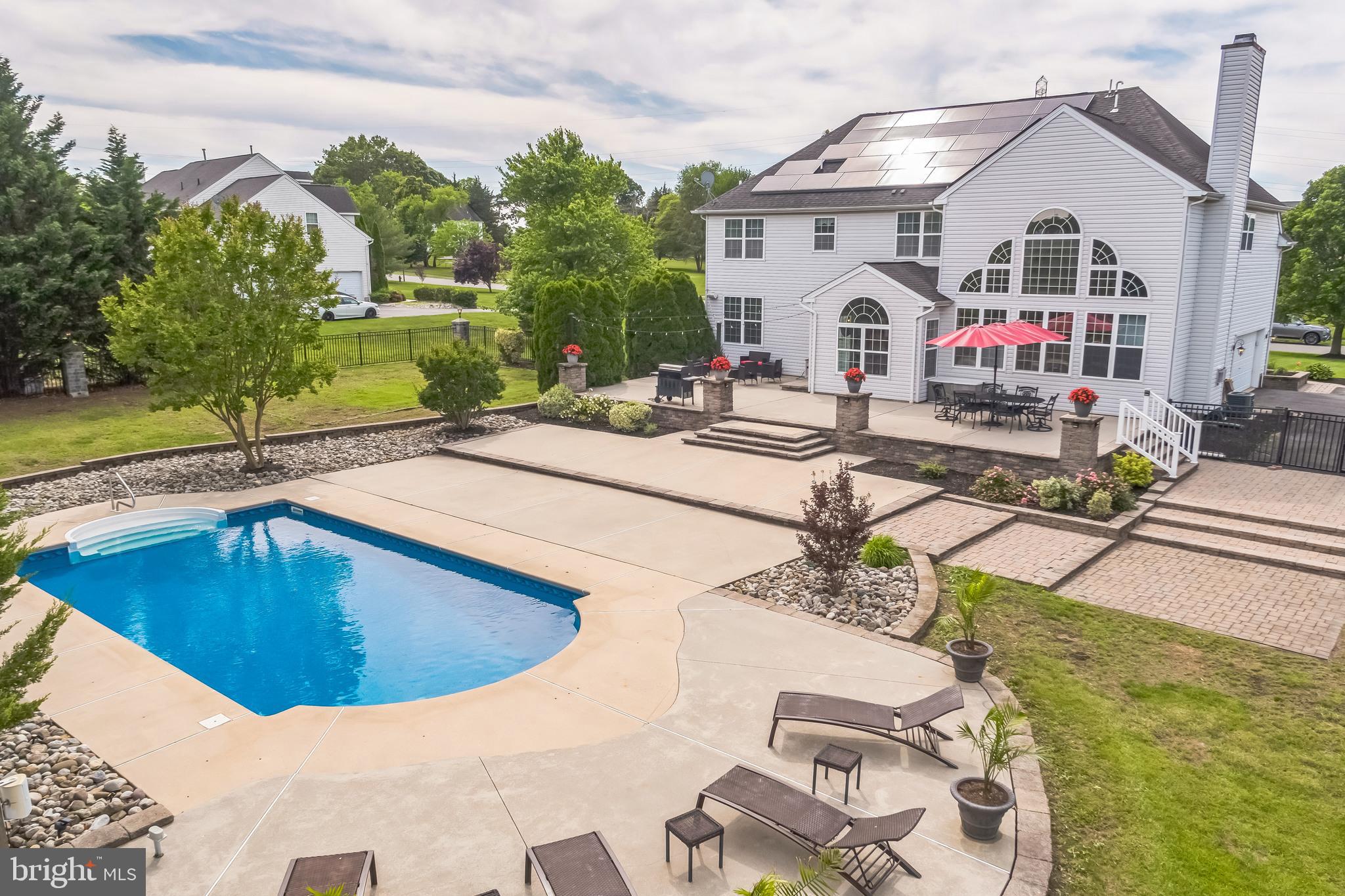 104 Abigail Lane Mickleton, NJ 08056 - Photo 45 of 75 a view of a house with swimming pool and sitting area