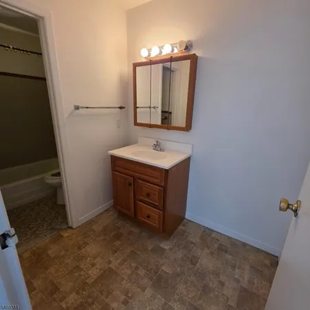 a bathroom with a sink and mirror