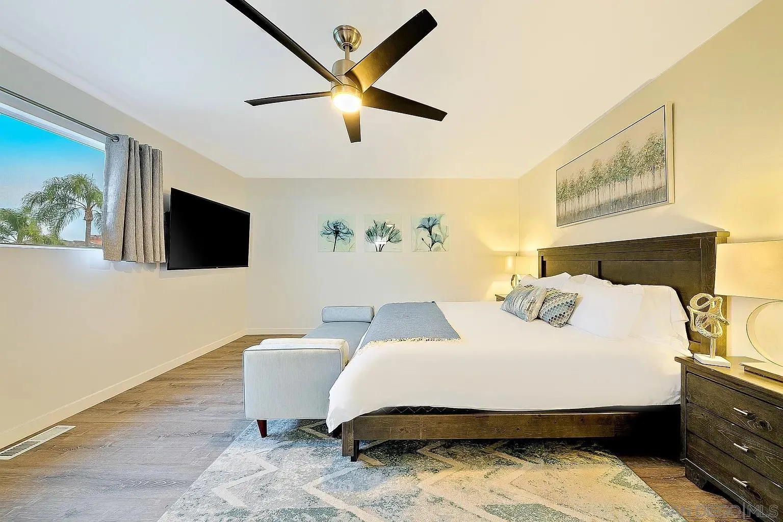 965 Rosecrans Street San Diego, CA 92106 - Photo 9 of 12 a bedroom with a bed and a flat screen tv