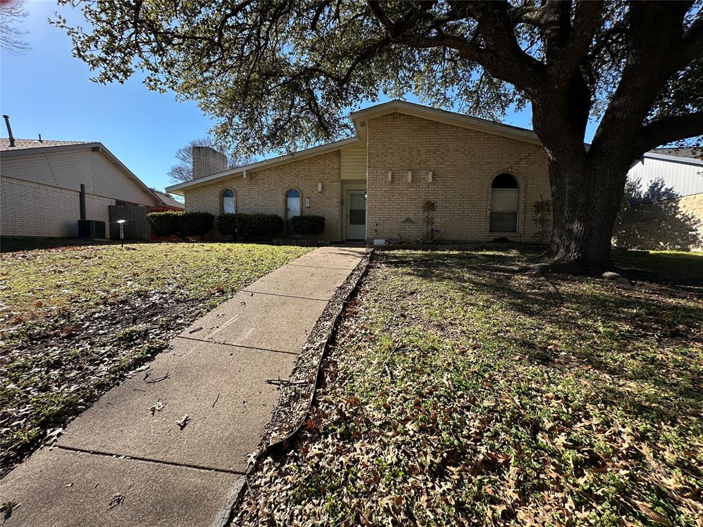 4601 Elm Ridge Lane Garland, TX 75044 - Photo 18 of 20 a house view with a backyard space