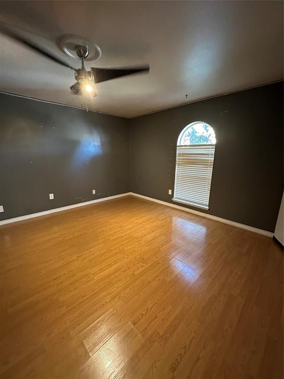 4601 Elm Ridge Lane Garland, TX 75044 - Photo 5 of 20 an empty room with a empty space and windows