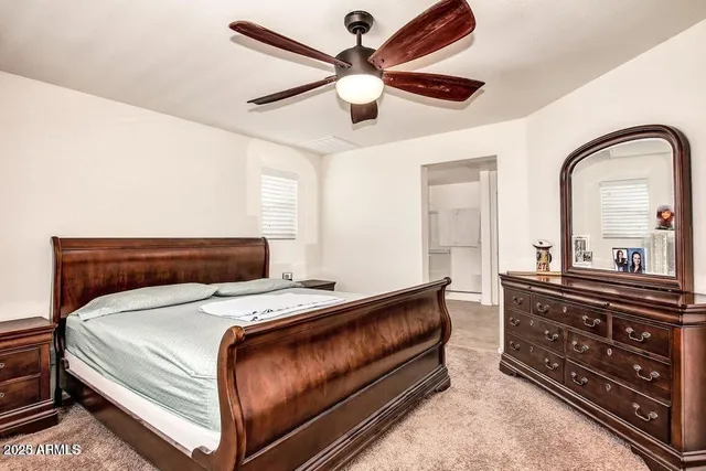 a bedroom with a bed and a dresser