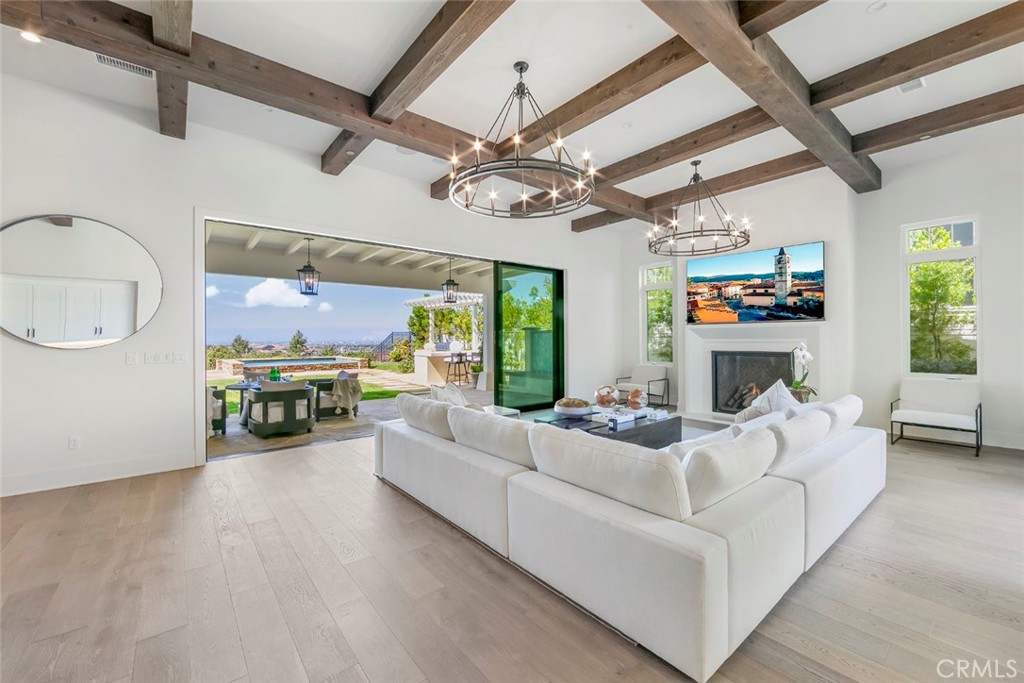 5 Rancho Elastico Road Rolling Hills Estates, CA 90274 - Photo 10 of 48 a living room with furniture or chandelier and a wooden floor