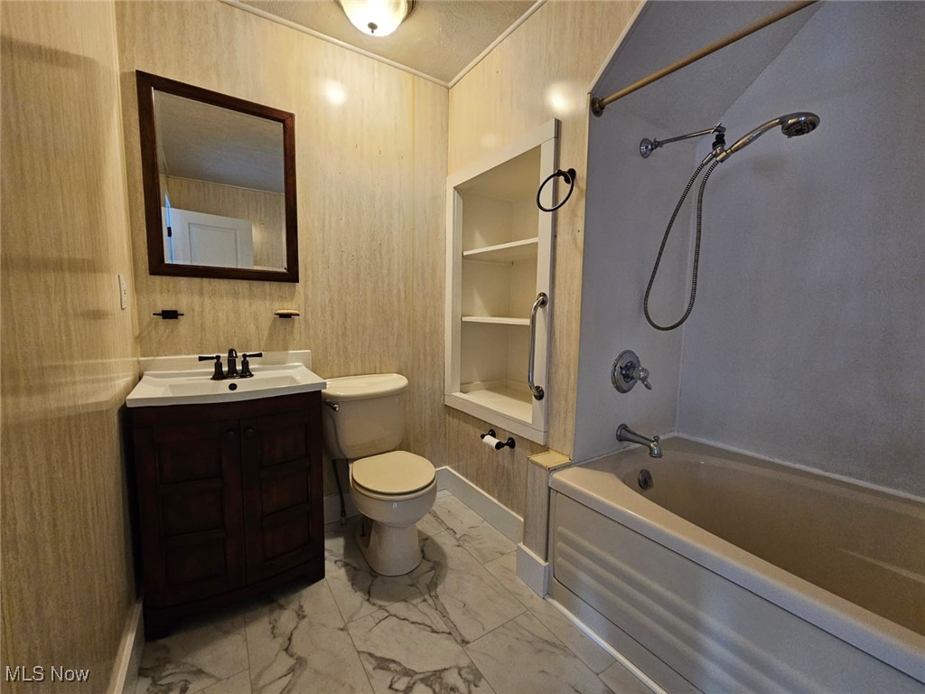 5961 State Rte 213 Toronto, OH 43964 - Photo 13 of 15 Full bathroom featuring toilet, vanity, and washtub / shower combination