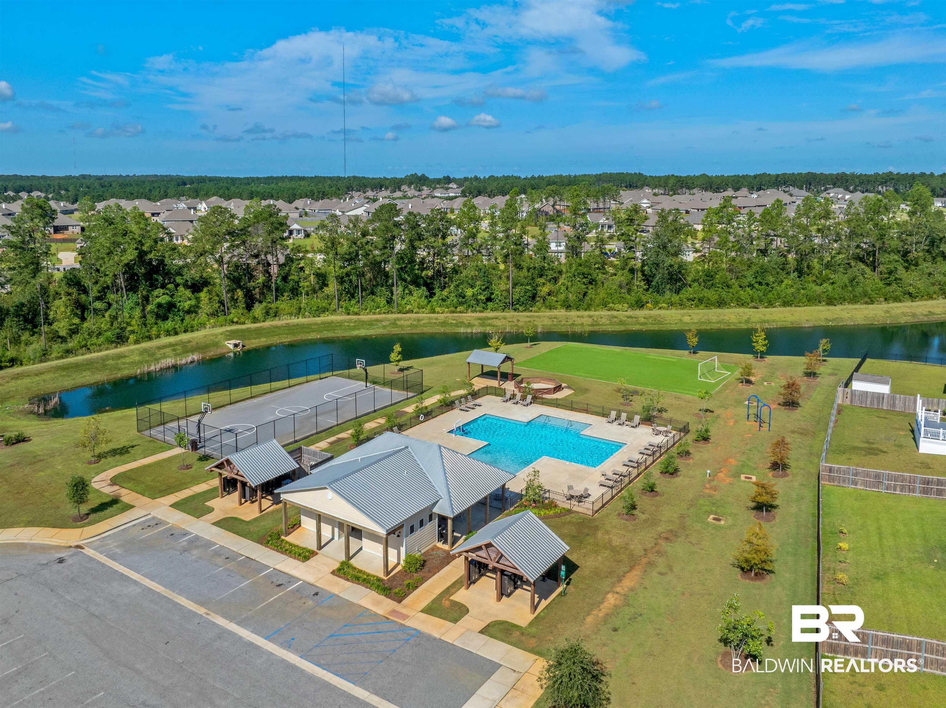 12738 Chickadee Lane Daphne, AL 36527 - Photo 23 of 30 Bird's eye view of a pool and a tree filled landscape