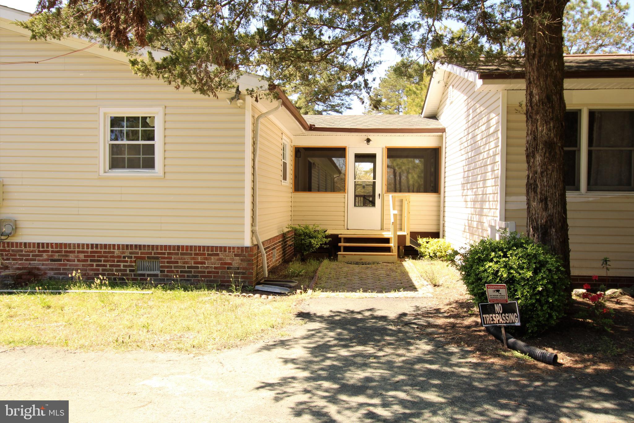 26438 Nanticoke Road Salisbury, MD 21801 - Photo 4 of 37 Screened porch to in law home