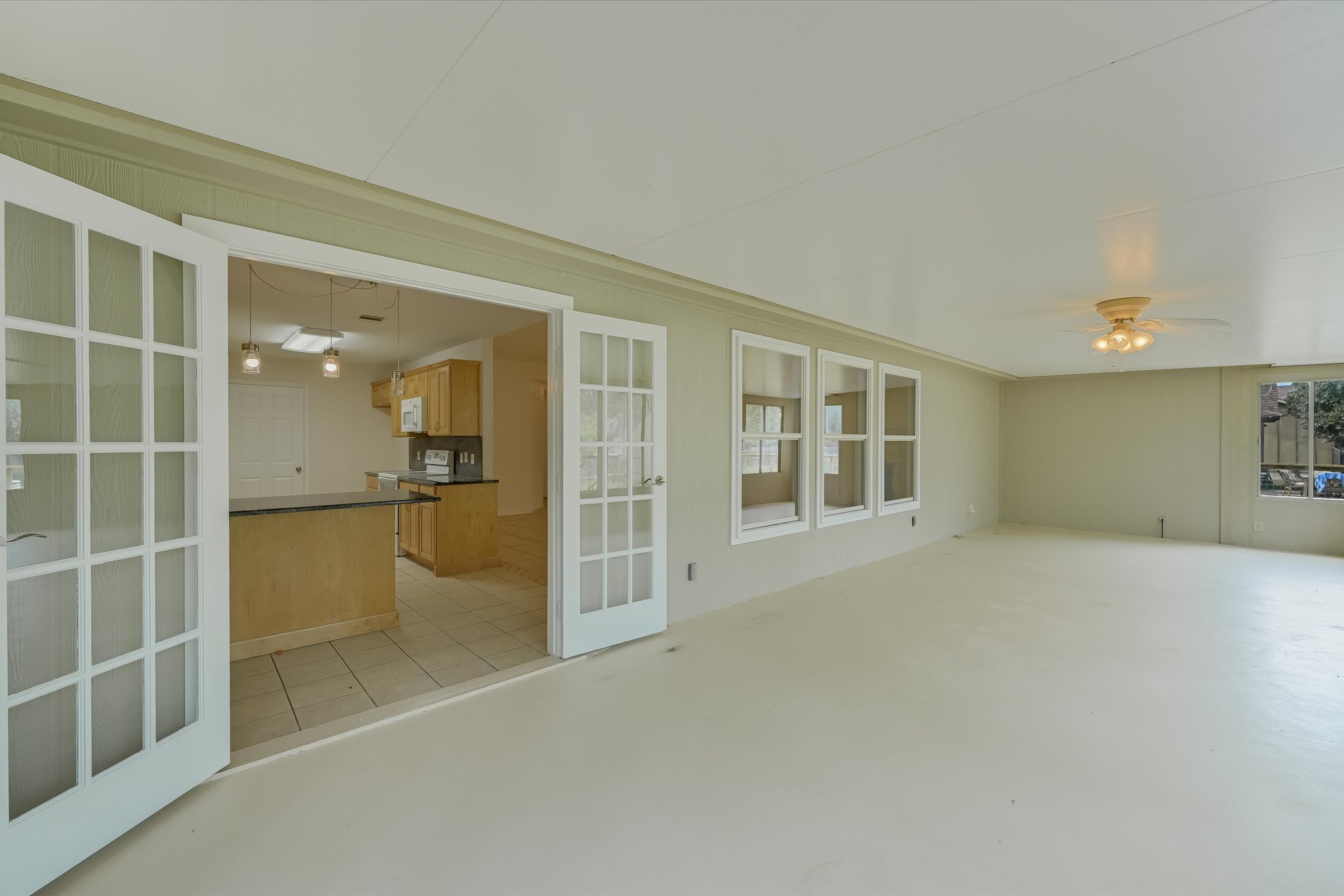 4 Memory Lane Wimberley, TX 78676 - Photo 10 of 24 Sun room opens into living and kitchen