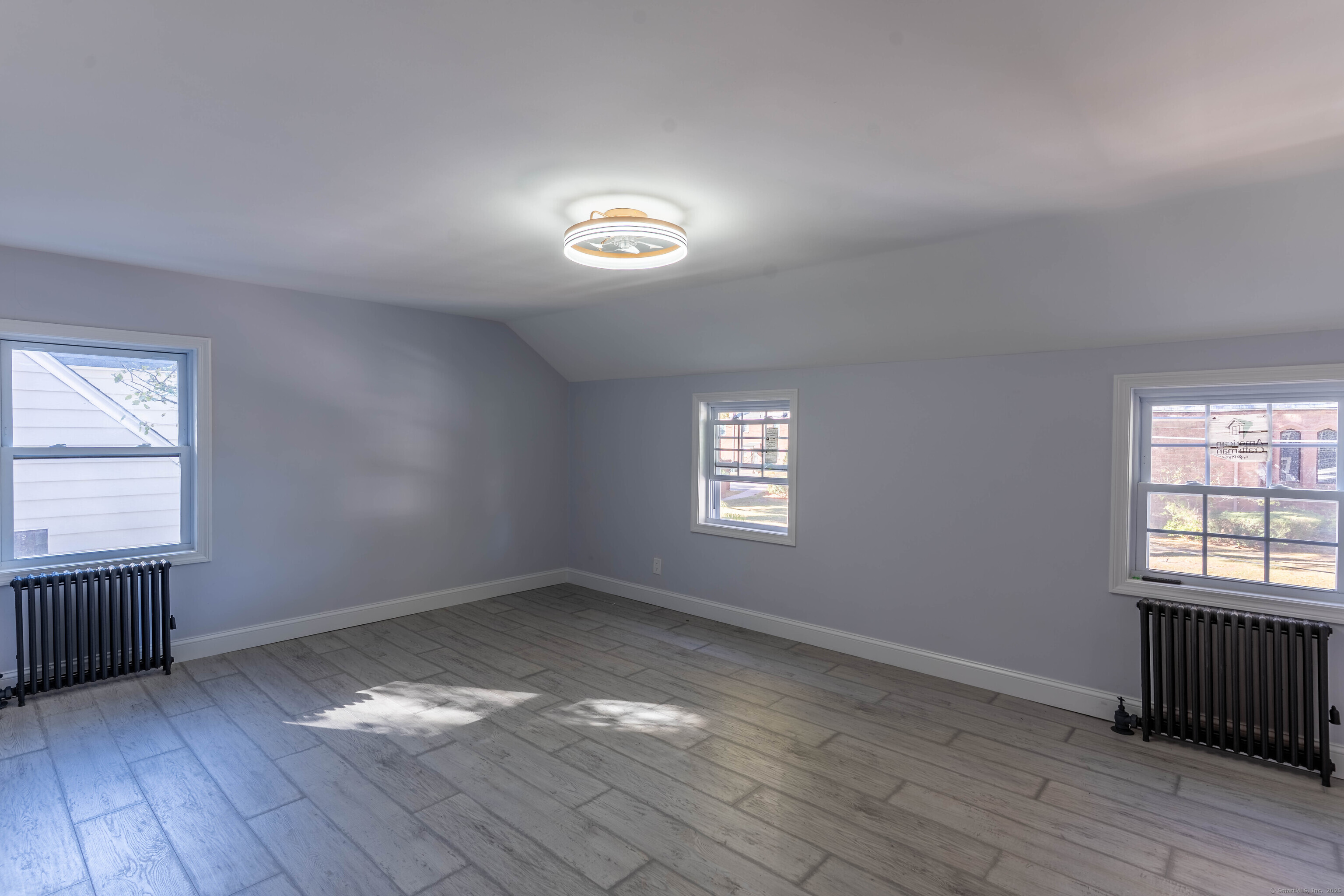 33 Bank Street Hamden, CT 06514 - Photo 13 of 32 an empty room with wooden floor and windows
