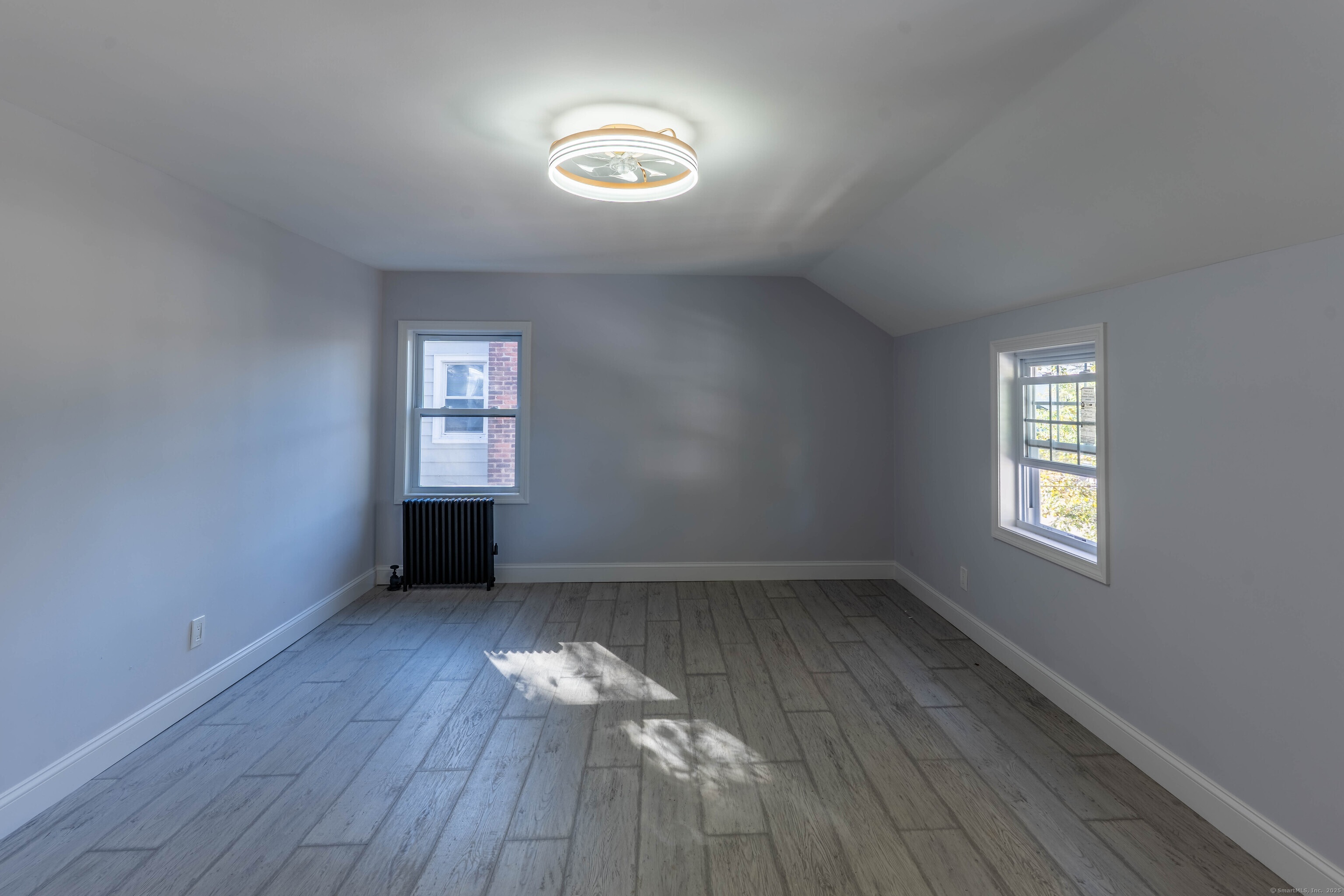 33 Bank Street Hamden, CT 06514 - Photo 14 of 32 an empty room with windows and closet