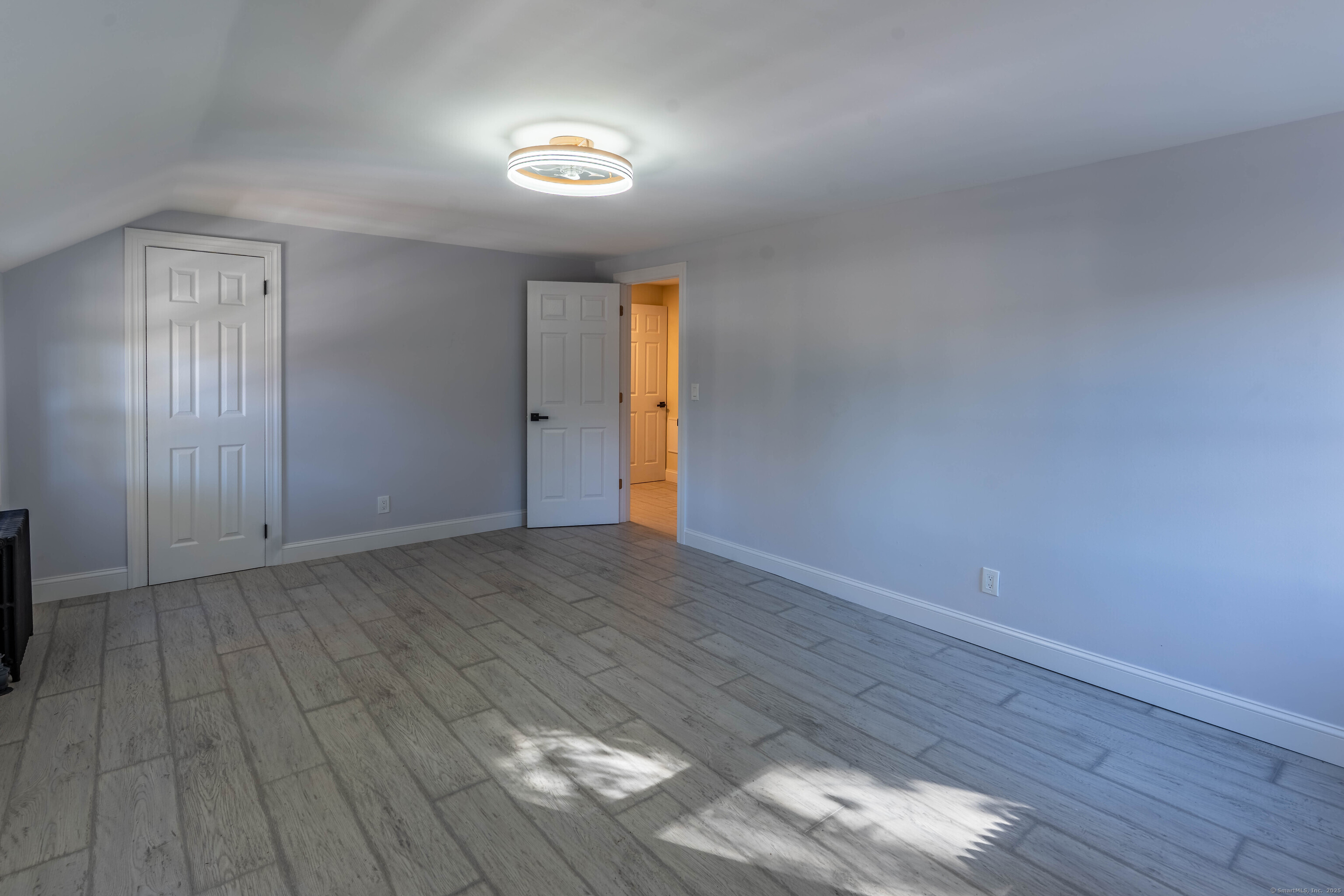 33 Bank Street Hamden, CT 06514 - Photo 15 of 32 a view of an empty room and wooden floor