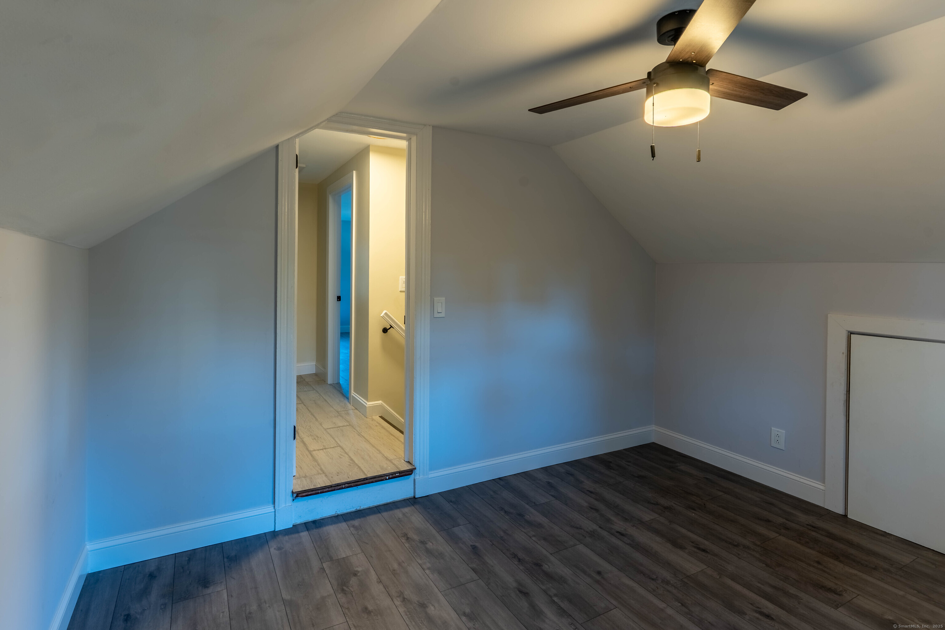 33 Bank Street Hamden, CT 06514 - Photo 16 of 32 an empty room with wooden floor fan and windows