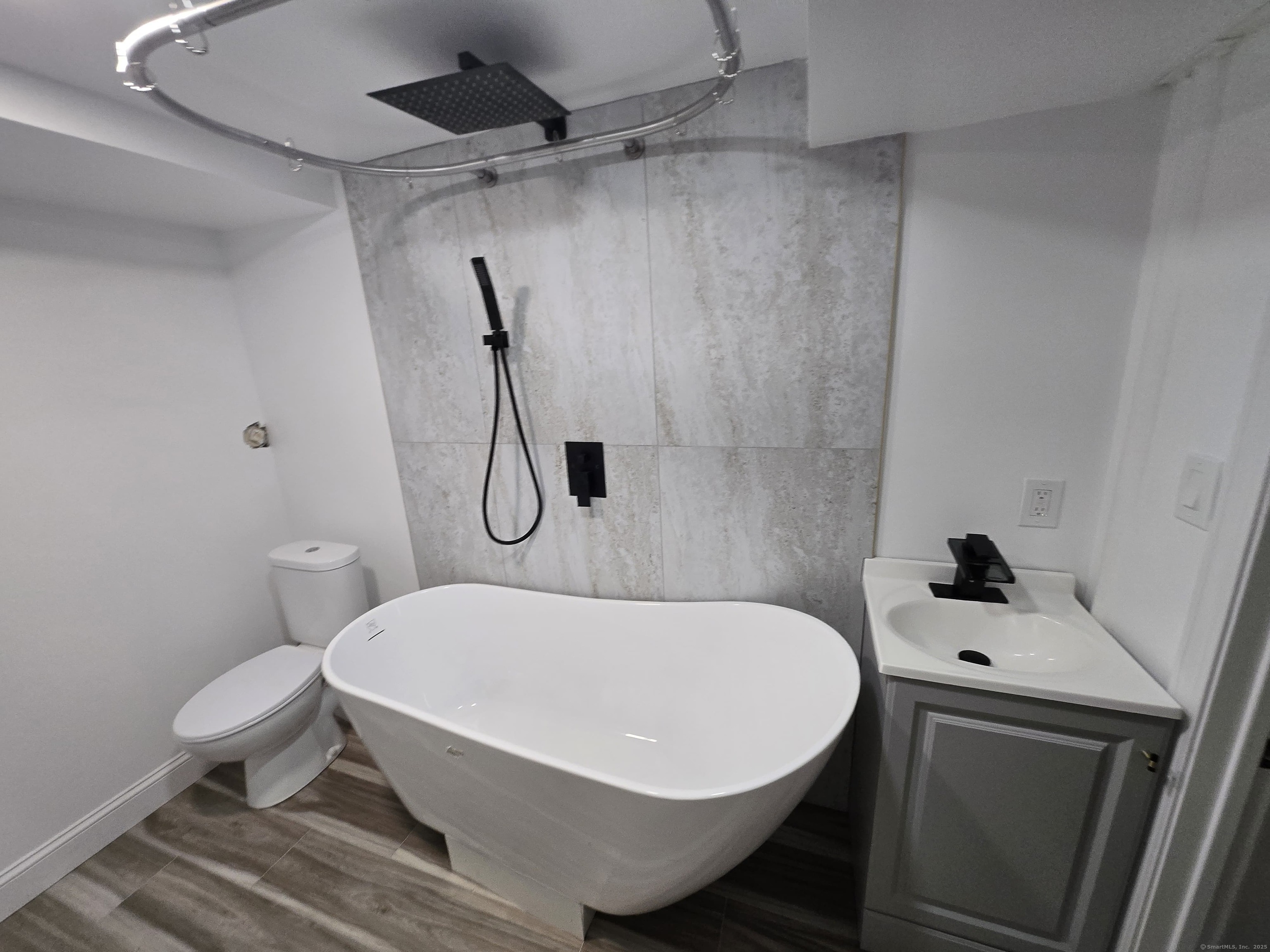 33 Bank Street Hamden, CT 06514 - Photo 19 of 32 a white bath tub sitting next to a white toilet and sink