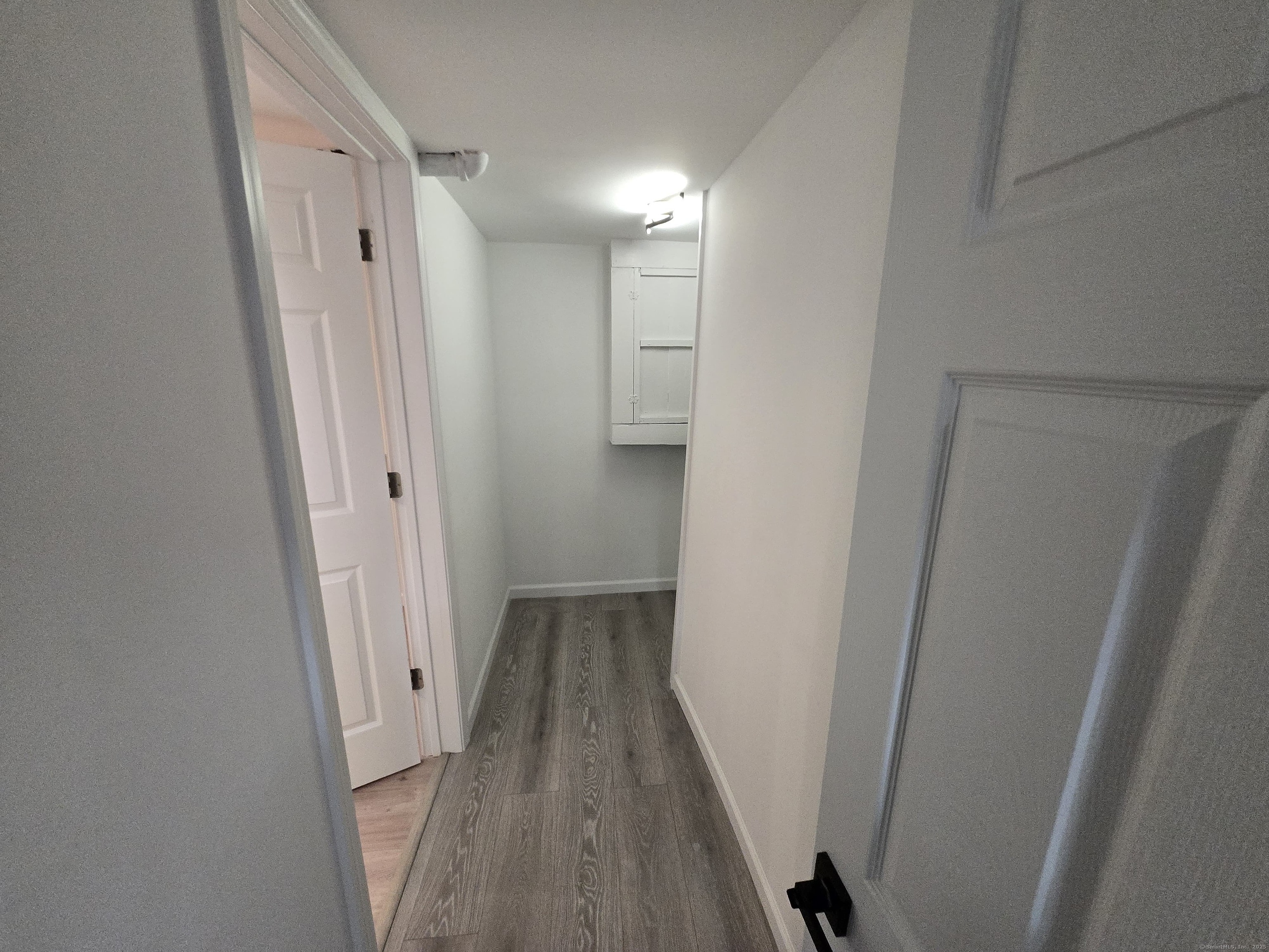 33 Bank Street Hamden, CT 06514 - Photo 23 of 32 a view of a hallway with wooden floor