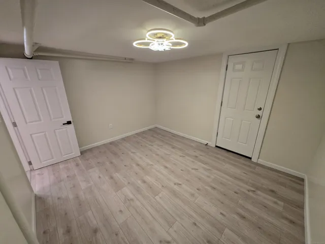 a view of an empty room with a window