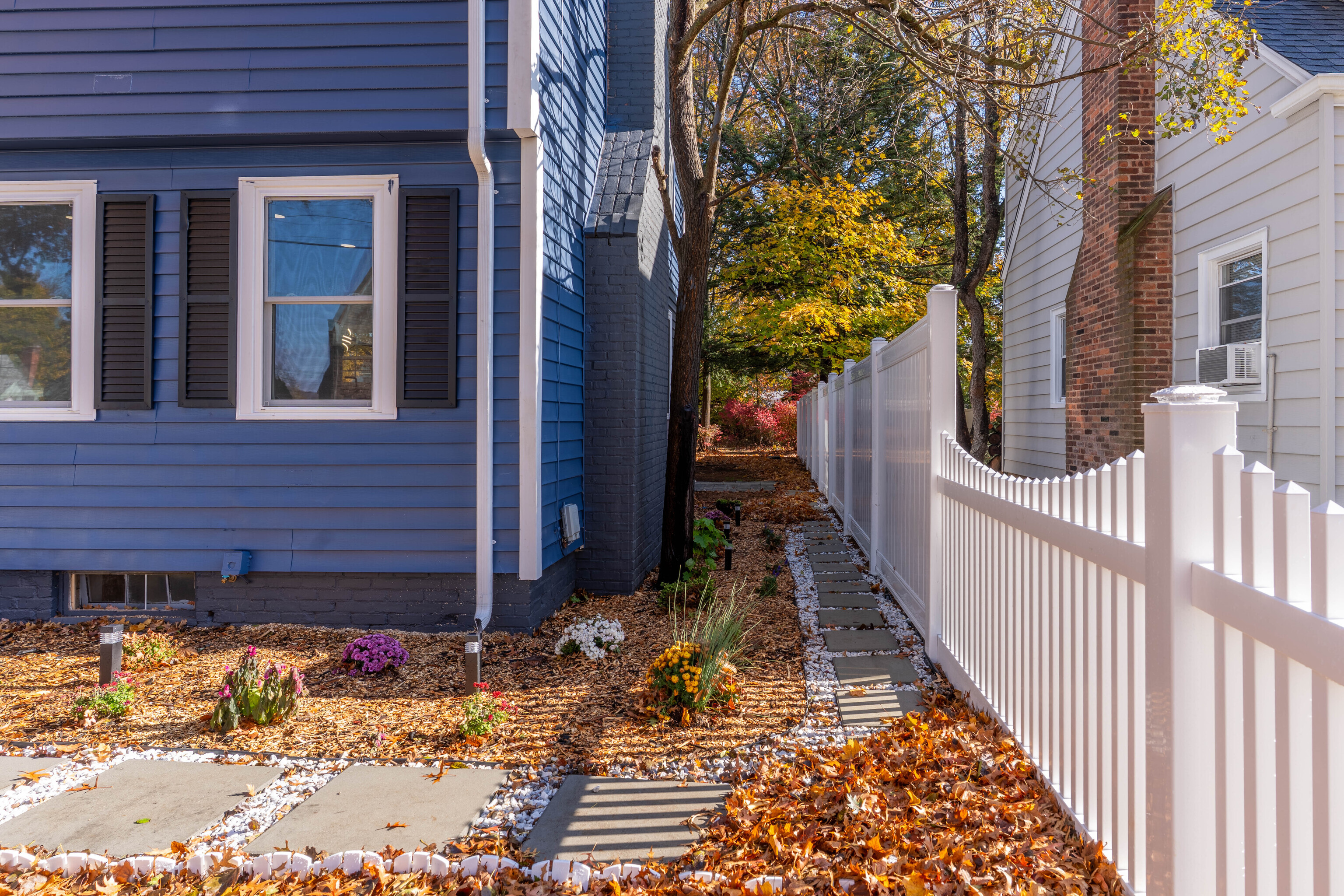 33 Bank Street Hamden, CT 06514 - Photo 29 of 32 a view of a house with wooden fence next to a brick wall