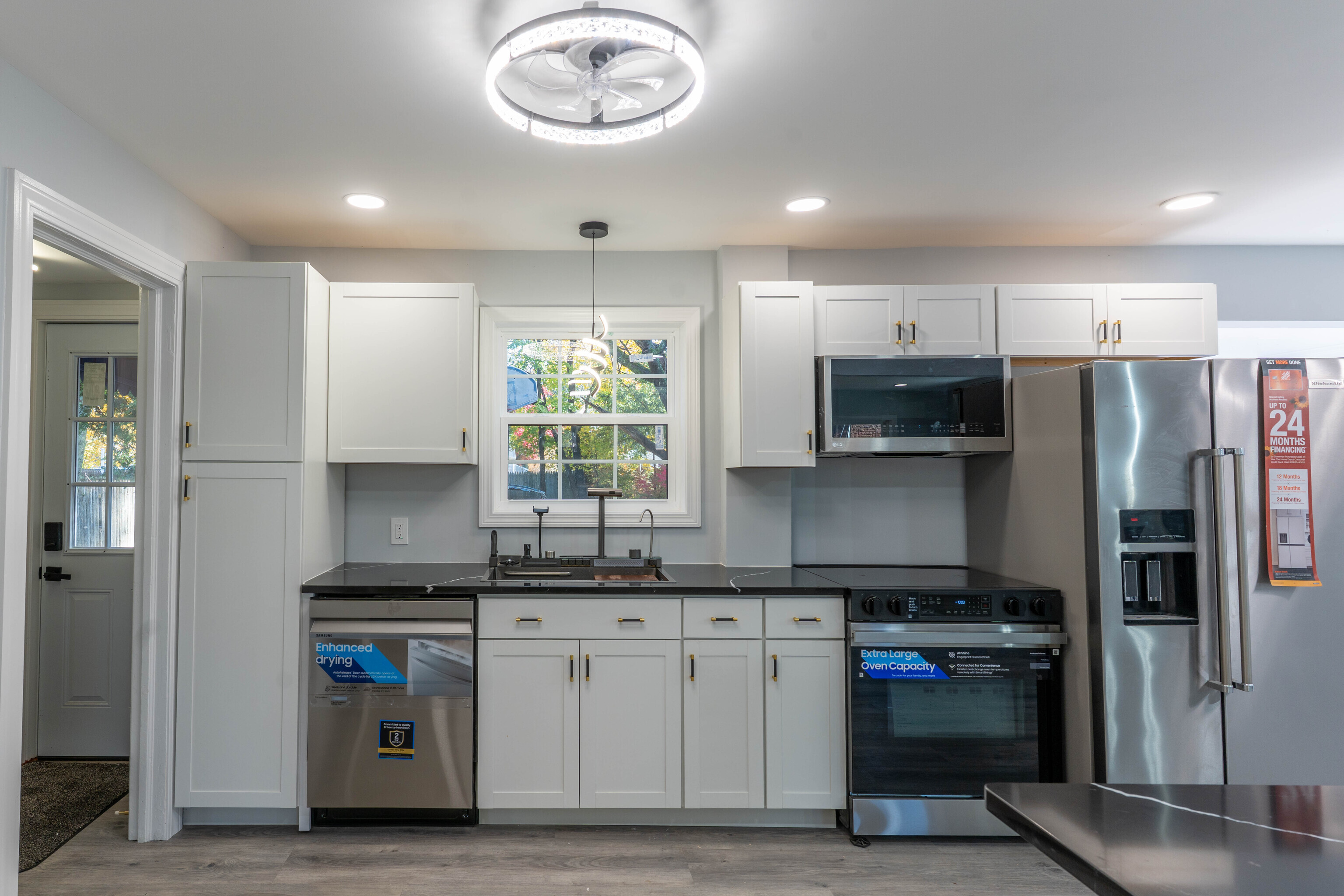 33 Bank Street Hamden, CT 06514 - Photo 5 of 32 a kitchen with stainless steel appliances a sink stove and refrigerator