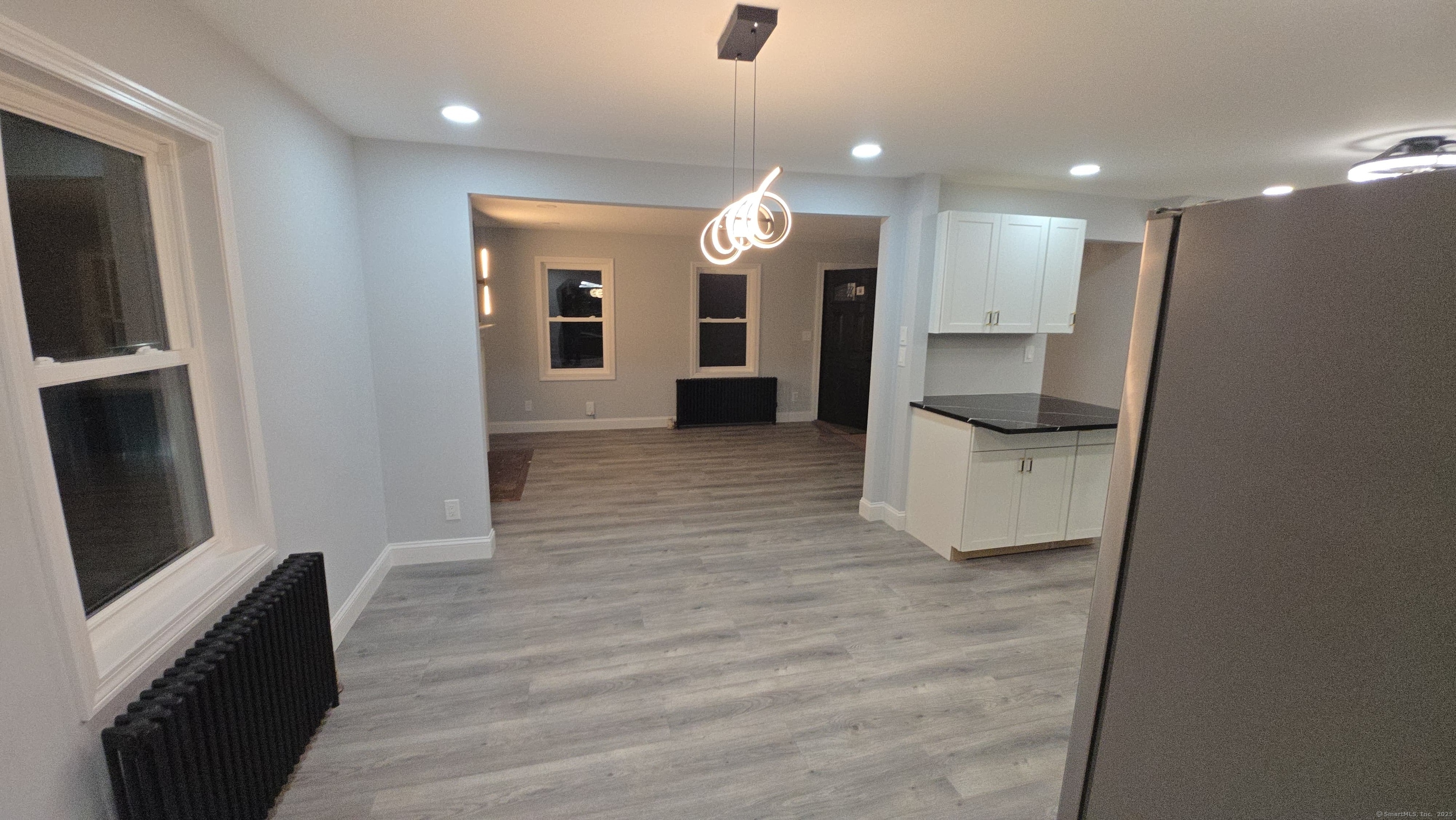33 Bank Street Hamden, CT 06514 - Photo 7 of 32 a view of a kitchen from a living room