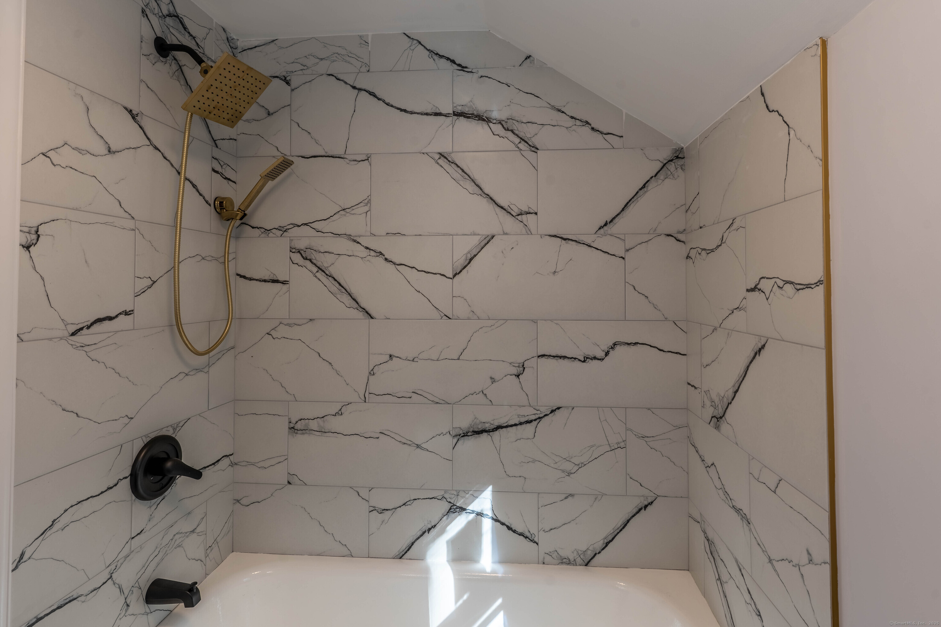 33 Bank Street Hamden, CT 06514 - Photo 10 of 32 a bathroom with a bathtub and shower