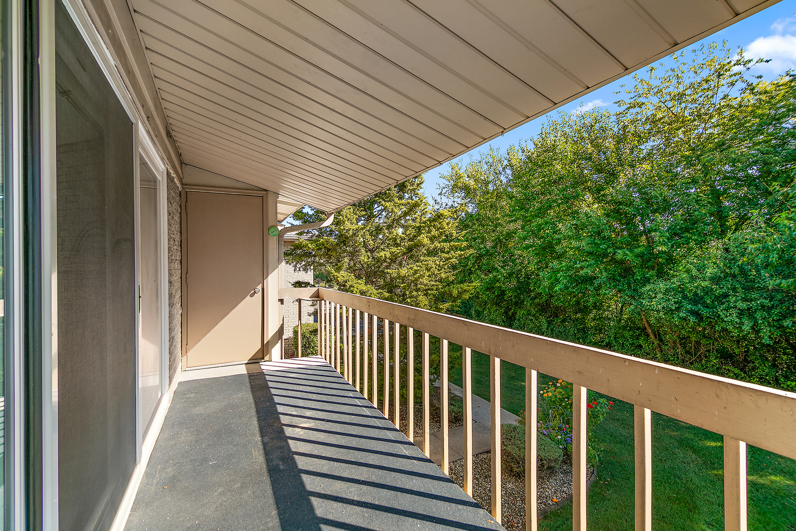 15717 Orlan Brook Drive, Unit 84 Orland Park, IL 60462 - Photo 15 of 18 a view of a balcony with wooden floor