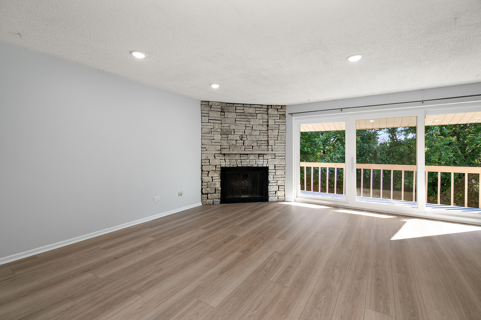 15717 Orlan Brook Drive, Unit 84 Orland Park, IL 60462 - Photo 2 of 18 a view of an empty room with wooden floor and a window