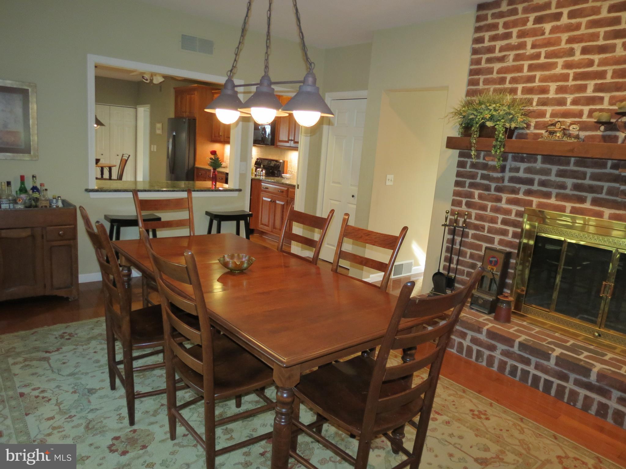 1130 Stonegate Road Hummelstown, PA 17036 - Photo 8 of 33 Dining Room/Wood burning brick fireplace