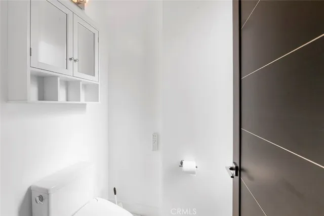 a bed room with bed and a potted plant