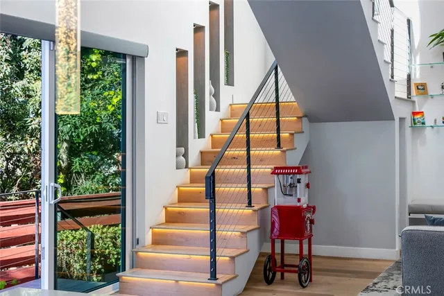 a kitchen with stainless steel appliances kitchen island granite countertop a refrigerator and a stove top oven