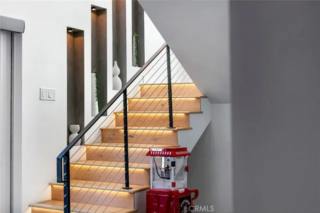 a kitchen with granite countertop a table and chairs in it