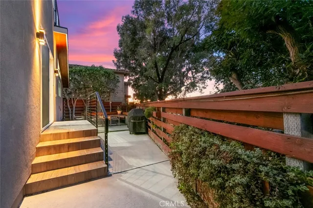 a living room with furniture kitchen and a table