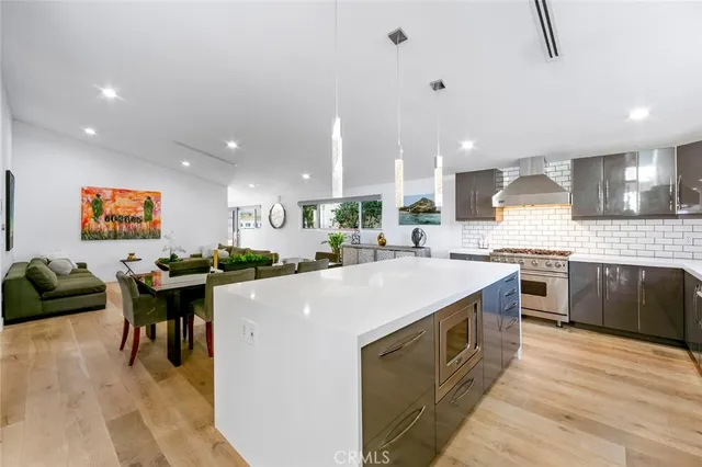 a large kitchen with a table and chairs in it