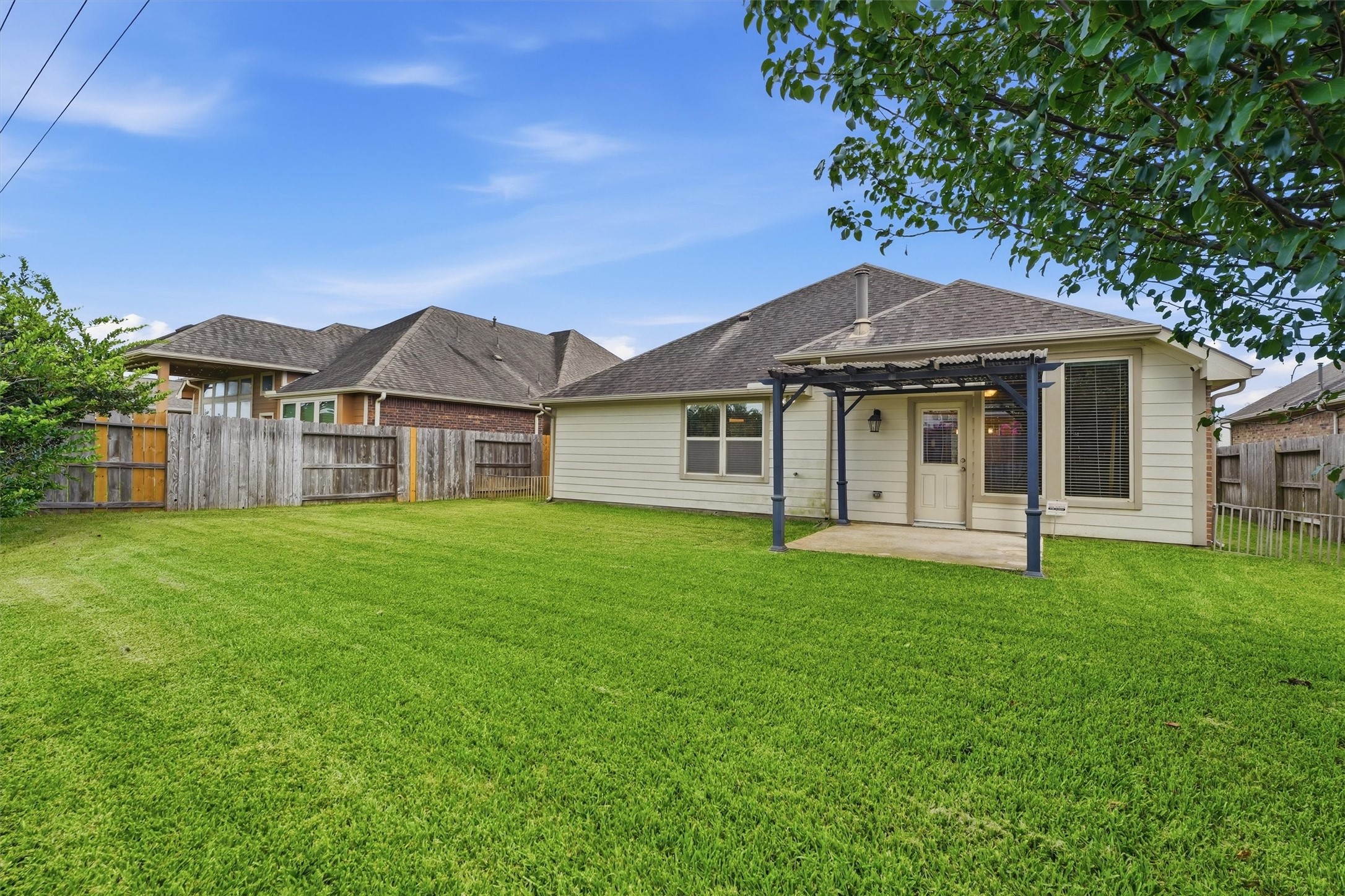 1911 Cedar Ridge Lane Pearland, TX 77089 - Photo 25 of 33 The pergola-covered patio creates the perfect spot for morning coffee or evening gatherings.