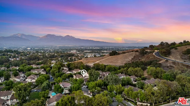 a view of a city with mountains in the background