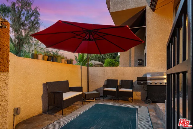 a view of an outdoor sitting area with chairs